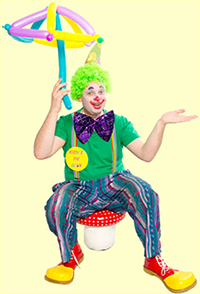 Noodles The Clown sitting on a mushroom stool